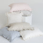 Foxtrot Home French Flax Linen styled in a bedroom with Stripes Ruffles Cushion Covers