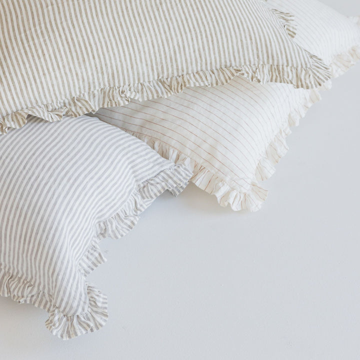 Foxtrot Home French Flax Linen styled in a bedroom with Stripes Ruffles Cushion Covers