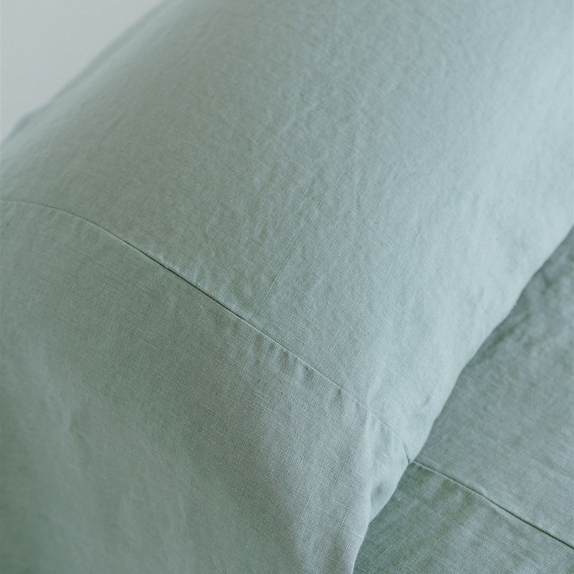 Foxtrot Home French Flax Linen styled in a bedroom with a Sage Green Bedspread
