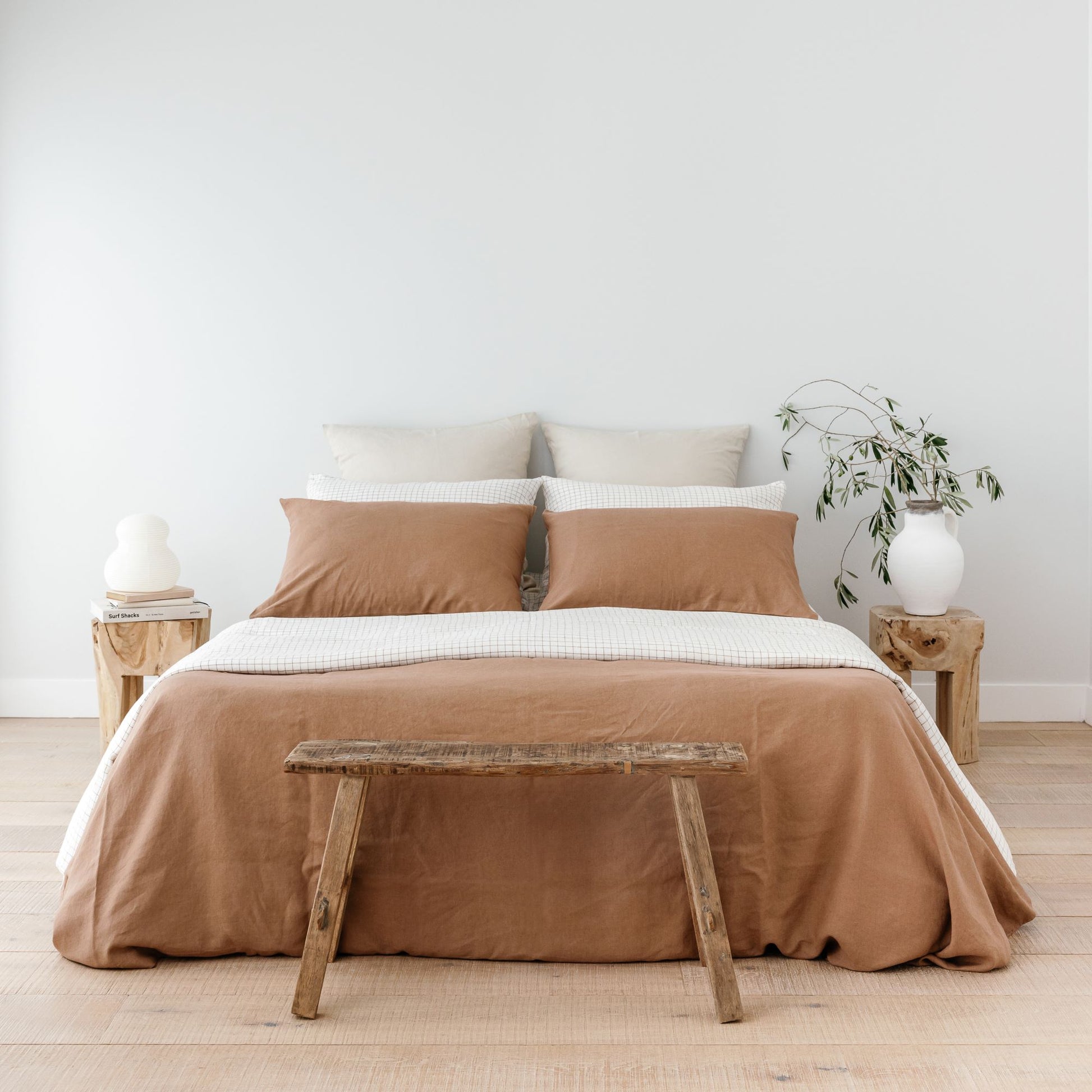 Foxtrot Home French Flax Linen styled with Malt Brown Grid Sheets and a Malt Brown Duvet
