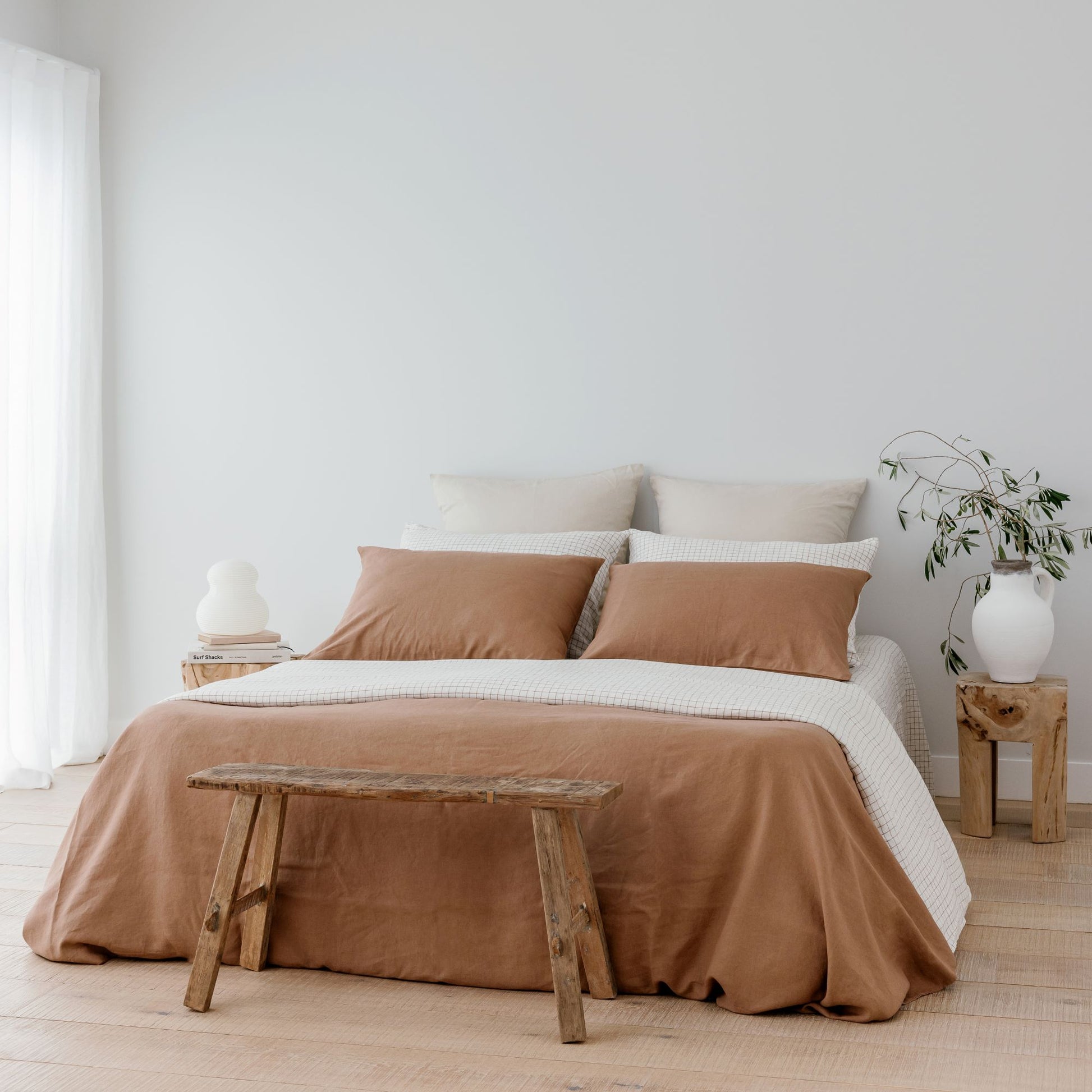Foxtrot Home French Flax Linen styled with Malt Brown Grid Sheets and a Malt Brown Duvet