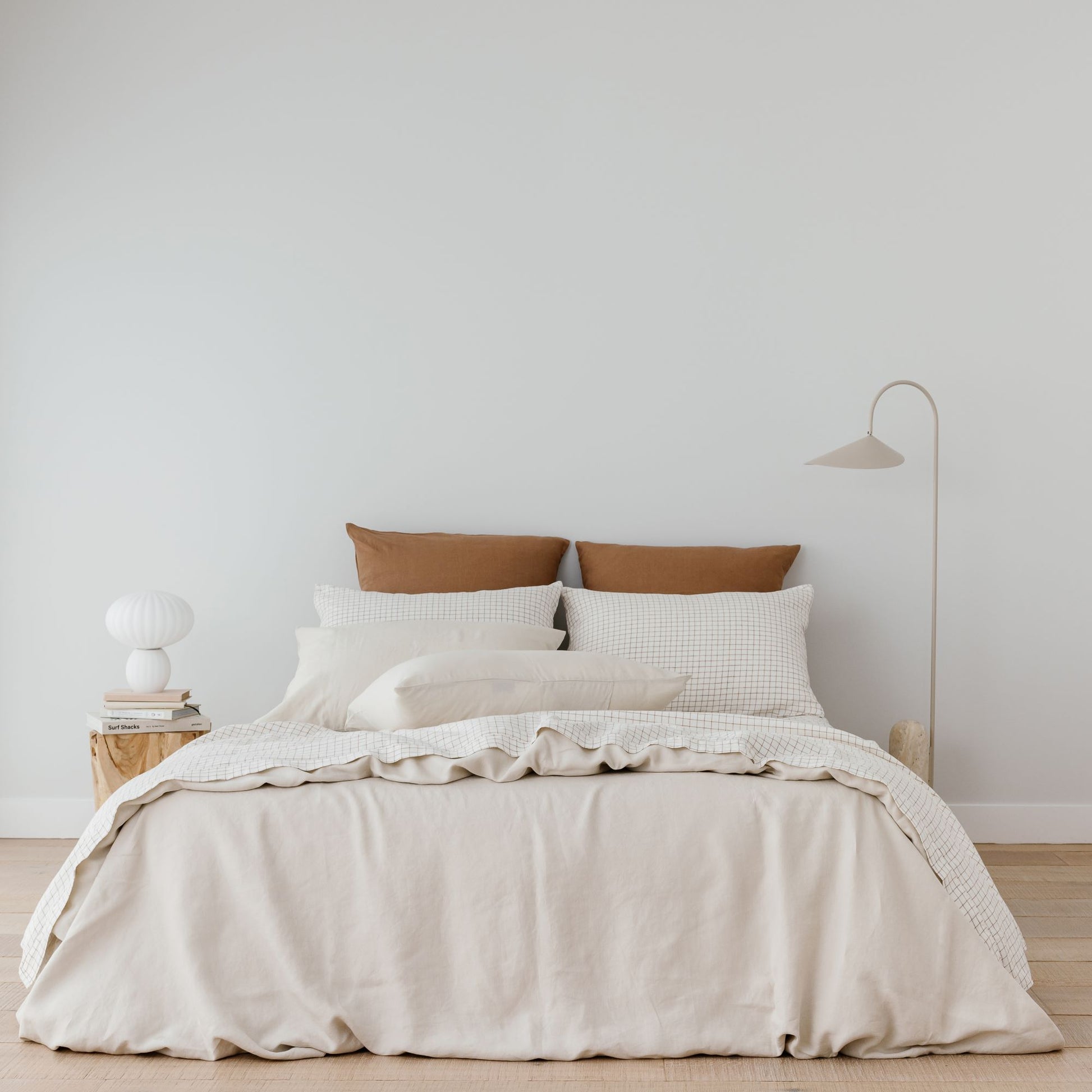 Foxtrot Home French Flax Linen styled with a Malt Brown Grid Sheets and an Oat Duvet