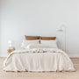 Foxtrot Home French Flax Linen styled with Malt Brown Grid Sheet Sets and an Oat Duvet