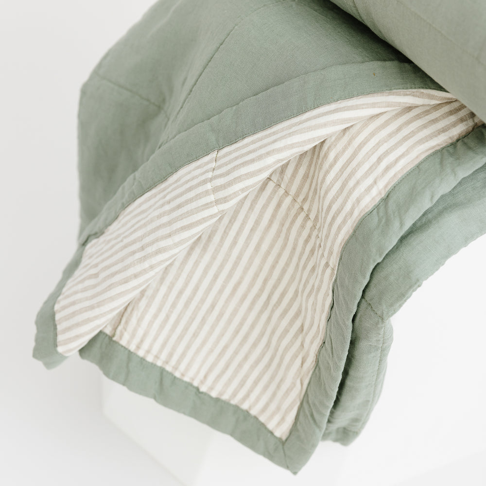 Foxtrot Home French Flax Linen Quilt in Sage with Sand Stripes on the reverse