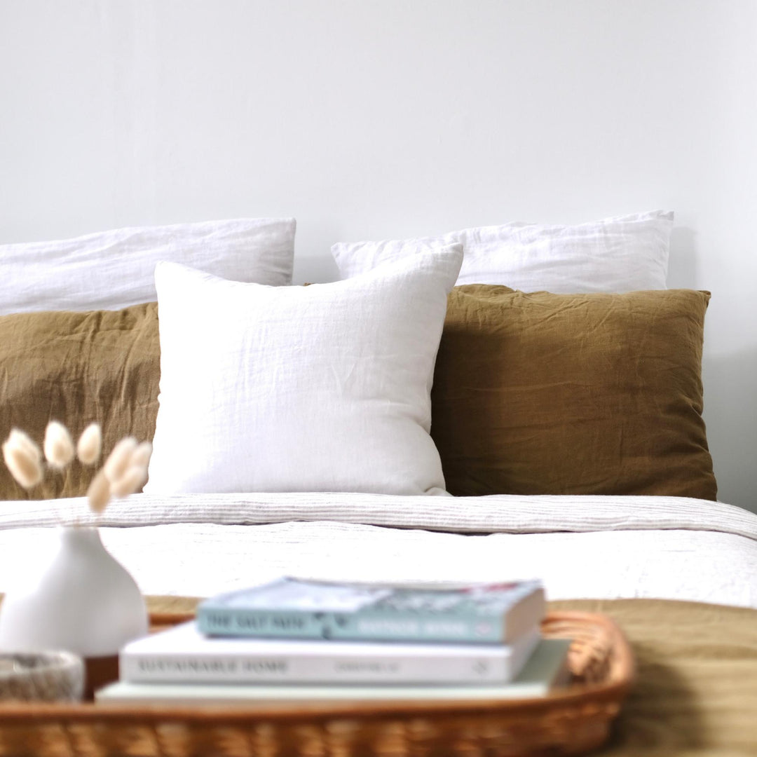 Foxtrot Home French Flax Linen styled in a bedroom with Brilliant White Cushion Cover.