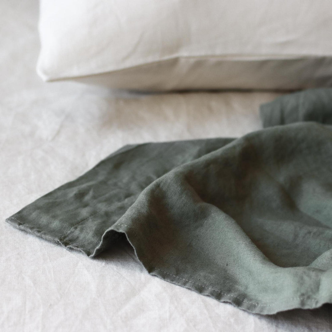 Foxtrot Home French Flax Linen styled in a bedroom with Cactus Green Flat Sheet.