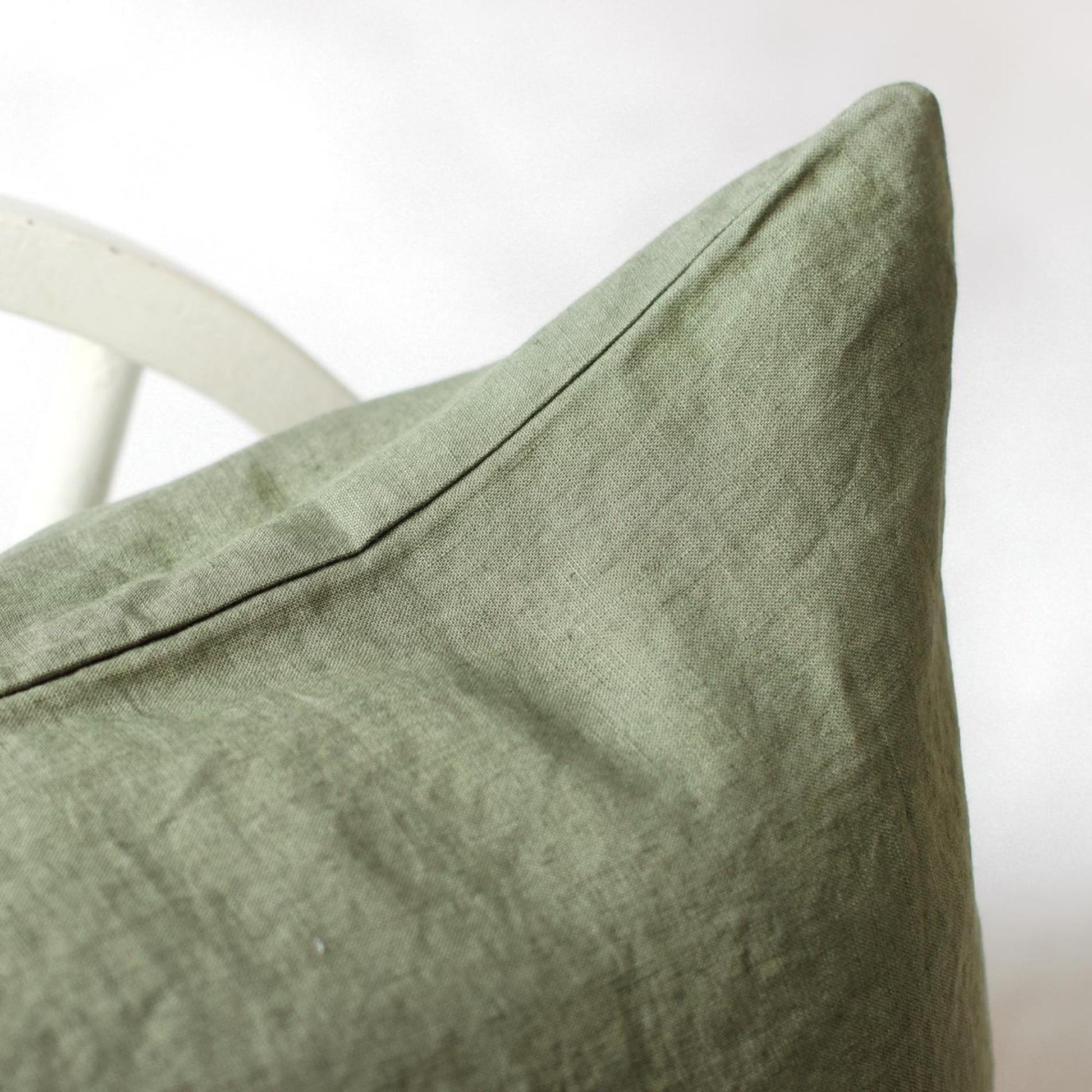 Foxtrot Home French Flax Linen styled in a bedroom with Cactus Green Pillowcases.