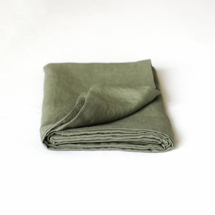 Foxtrot Home French Flax Linen styled in a bedroom with Cactus Green Pillowcases.