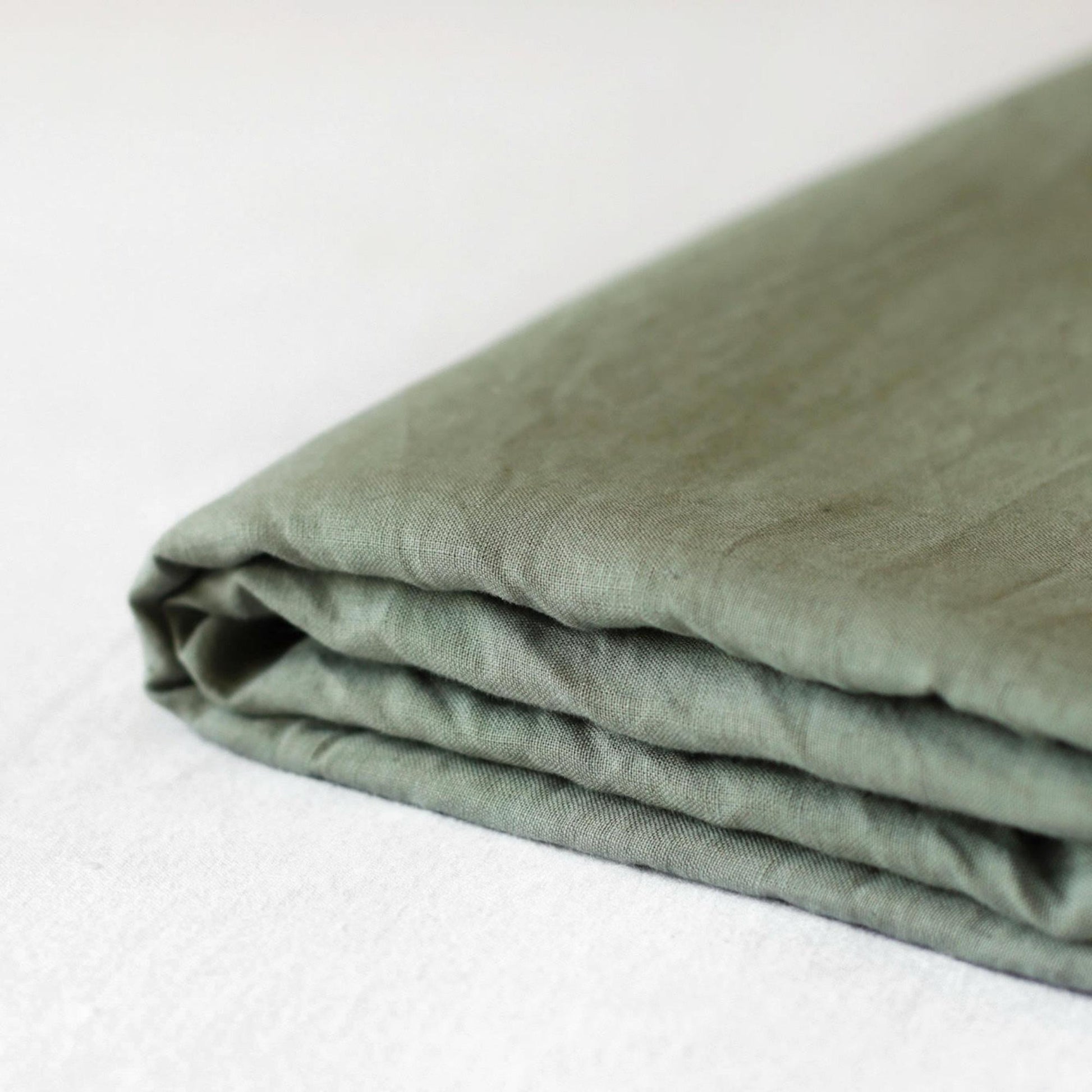 Foxtrot Home French Flax Linen styled in a bedroom with Cactus Green Sheets Set.