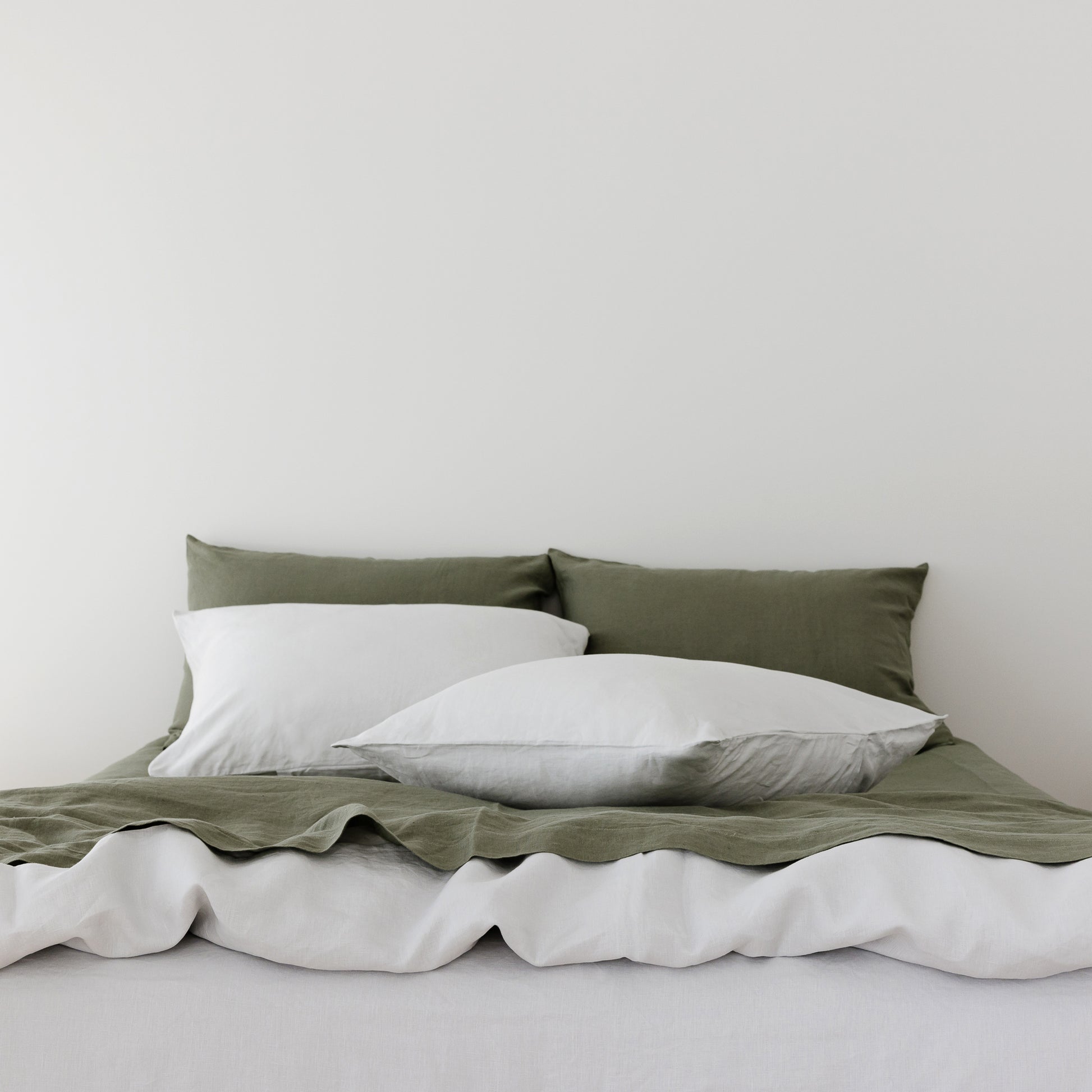 Foxtrot Home French Flax Linen styled in a bedroom with Cactus Green Sheets Set.