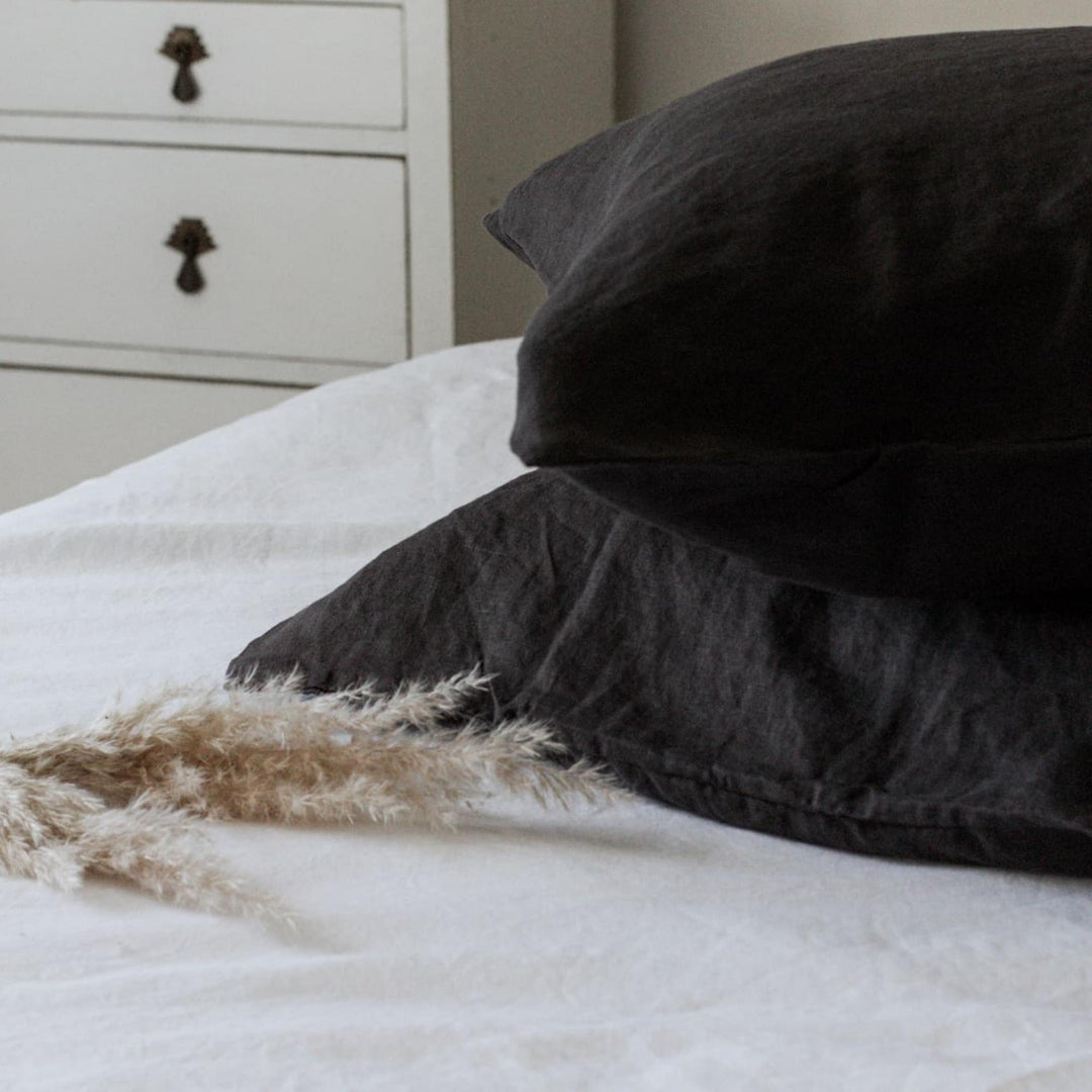 Foxtrot Home French Flax Linen styled in a bedroom with Charcoal Pillowcases.