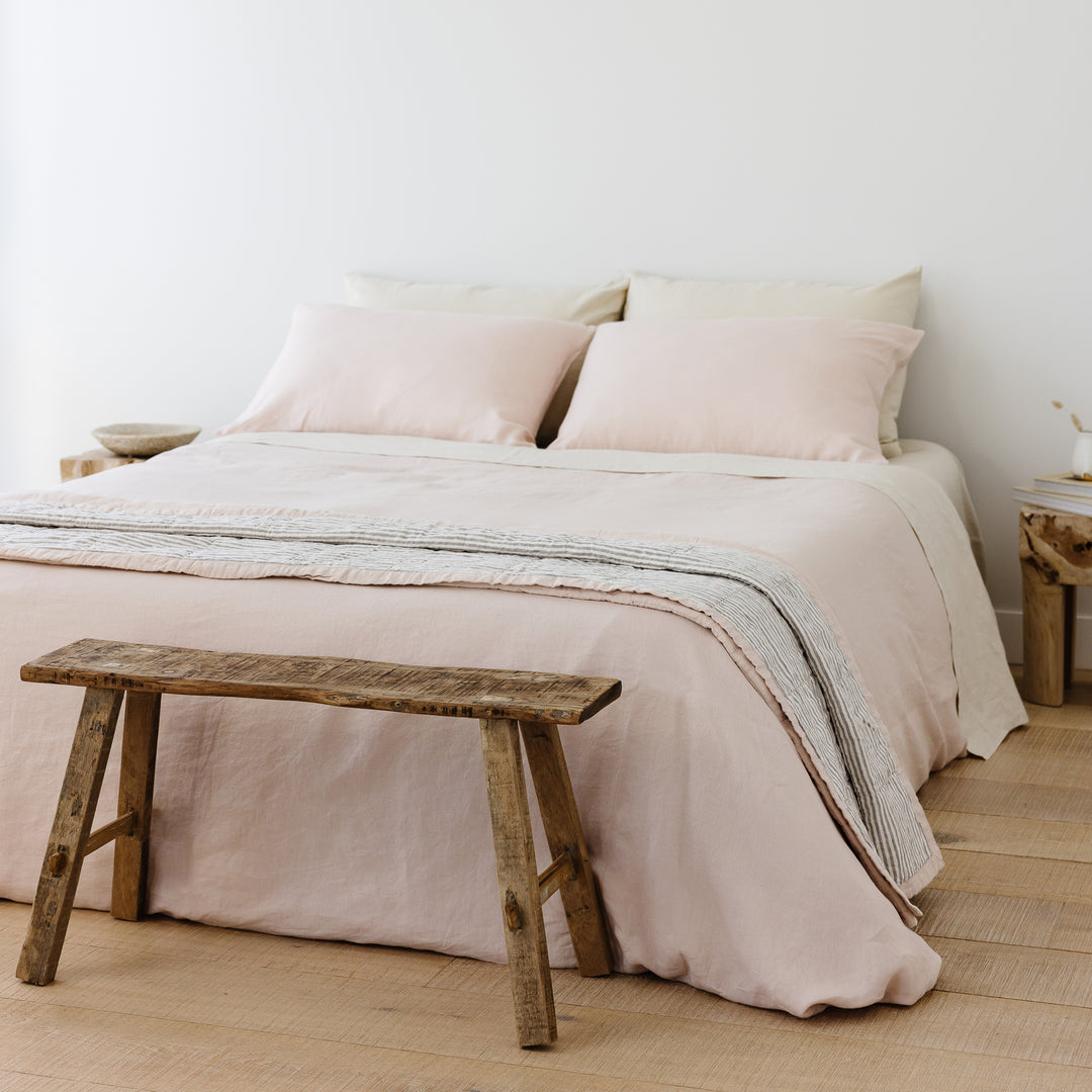 Foxtrot Home French Flax Linen styled in a bedroom with Blush Pink Duvet, Oat Sheets Set and Pillowcases.
