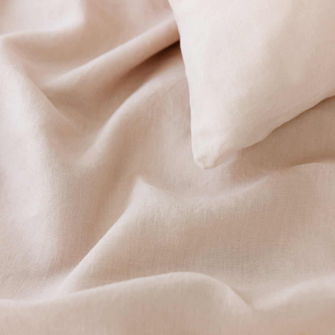 Foxtrot Home French Flax Linen styled in a bedroom with Blush Pink Duvet, Oat Sheets Set and Pillowcases.