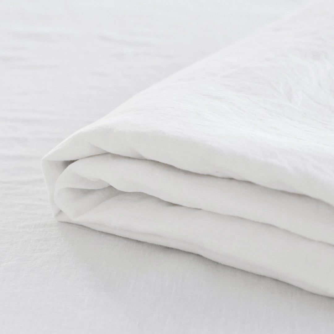Foxtrot Home French Flax Linen styled in a bedroom with Brilliant White Fitted Sheet.
