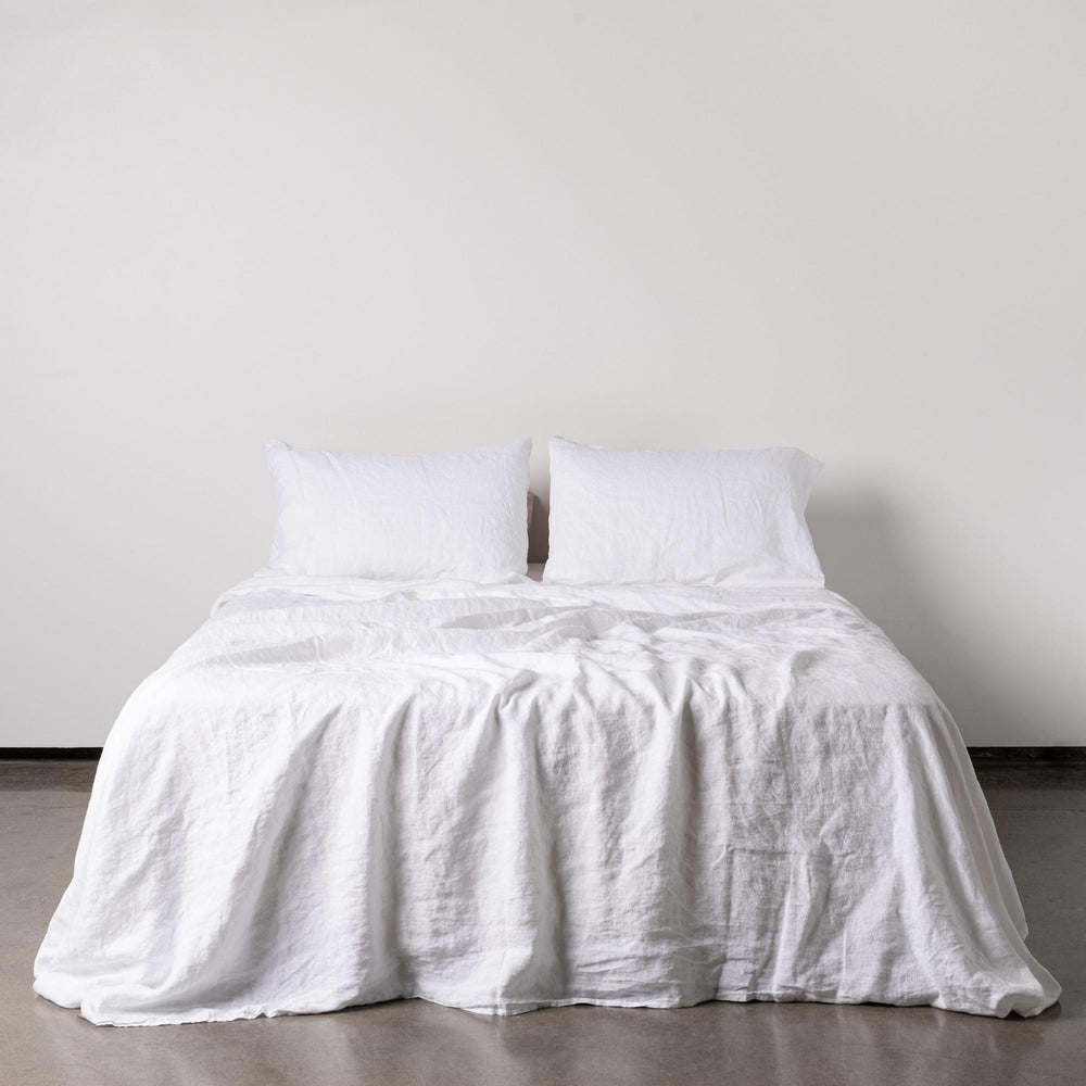 Foxtrot Home French Flax Linen styled in a bedroom with Brilliant White Fitted Sheet.