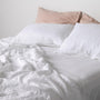 Foxtrot Home French Flax Linen styled in a bedroom with Brilliant White Fitted Sheet.