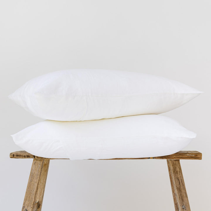 Foxtrot Home French Flax Linen styled in a bedroom with Brilliant White Pillowcases.