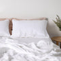 Foxtrot Home French Flax Linen styled in a bedroom with Brilliant White Sheets Set.