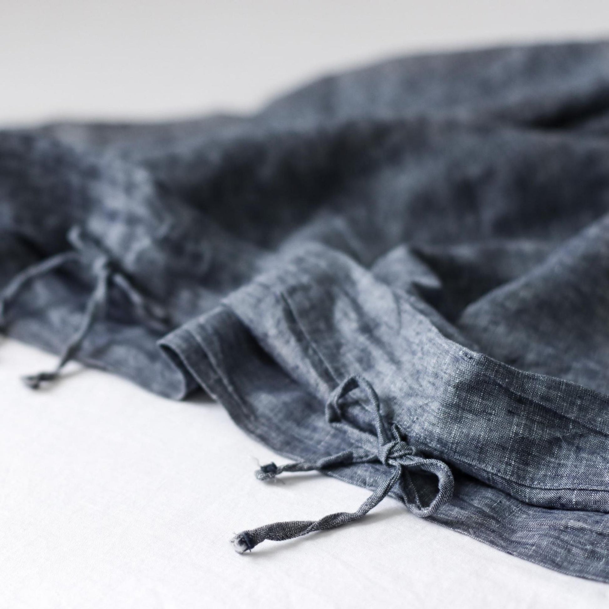 Foxtrot Home French Flax Linen styled in a baby's bedroom with a Denim Blue Cot Duvet.