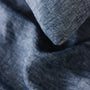 Foxtrot Home French Flax Linen styled in a bedroom with Denim Blue Duvet.