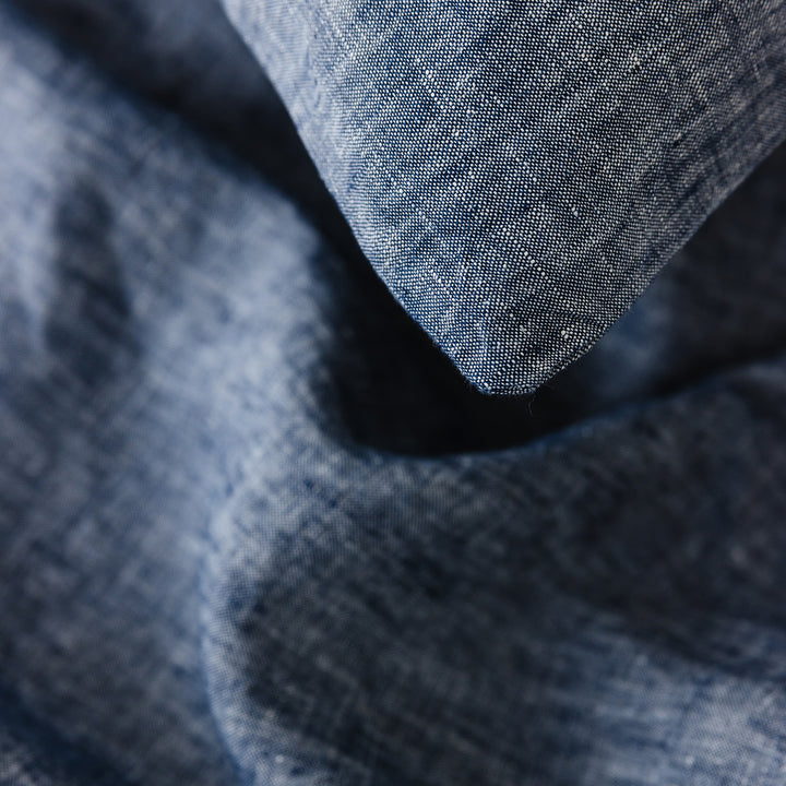 Foxtrot Home French Flax Linen styled in a bedroom with Denim Blue Duvet.