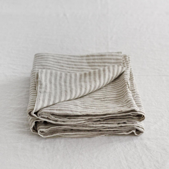 Foxtrot Home French Flax Linen styled in a bedroom with Grey Stripes Pillowcases.