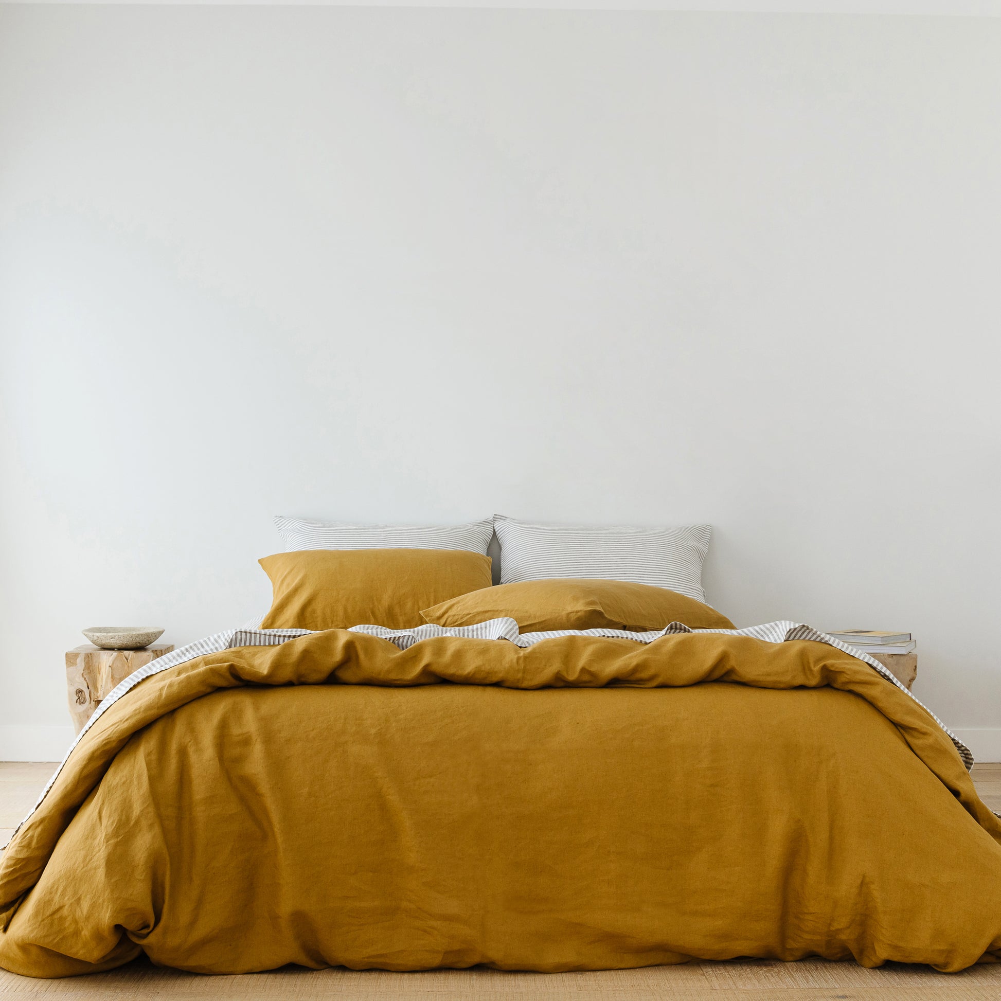 Foxtrot Home French Flax Linen styled in a bedroom with Ginger Honey Duvet.
