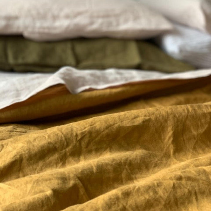 Foxtrot Home French Flax Linen styled in a bedroom with Ginger Honey Duvet.