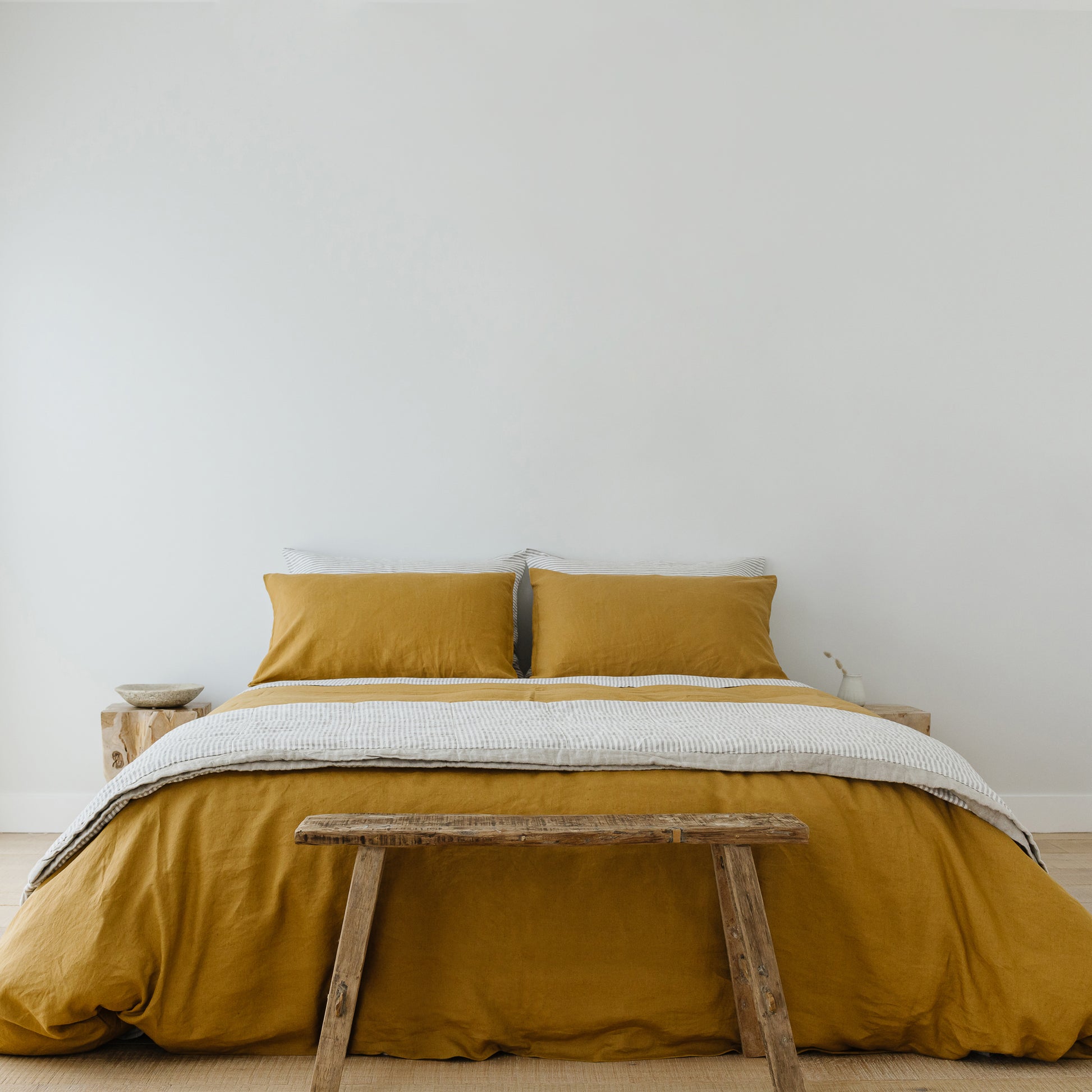 Foxtrot Home French Flax Linen styled in a bedroom with Ginger Honey Duvet.