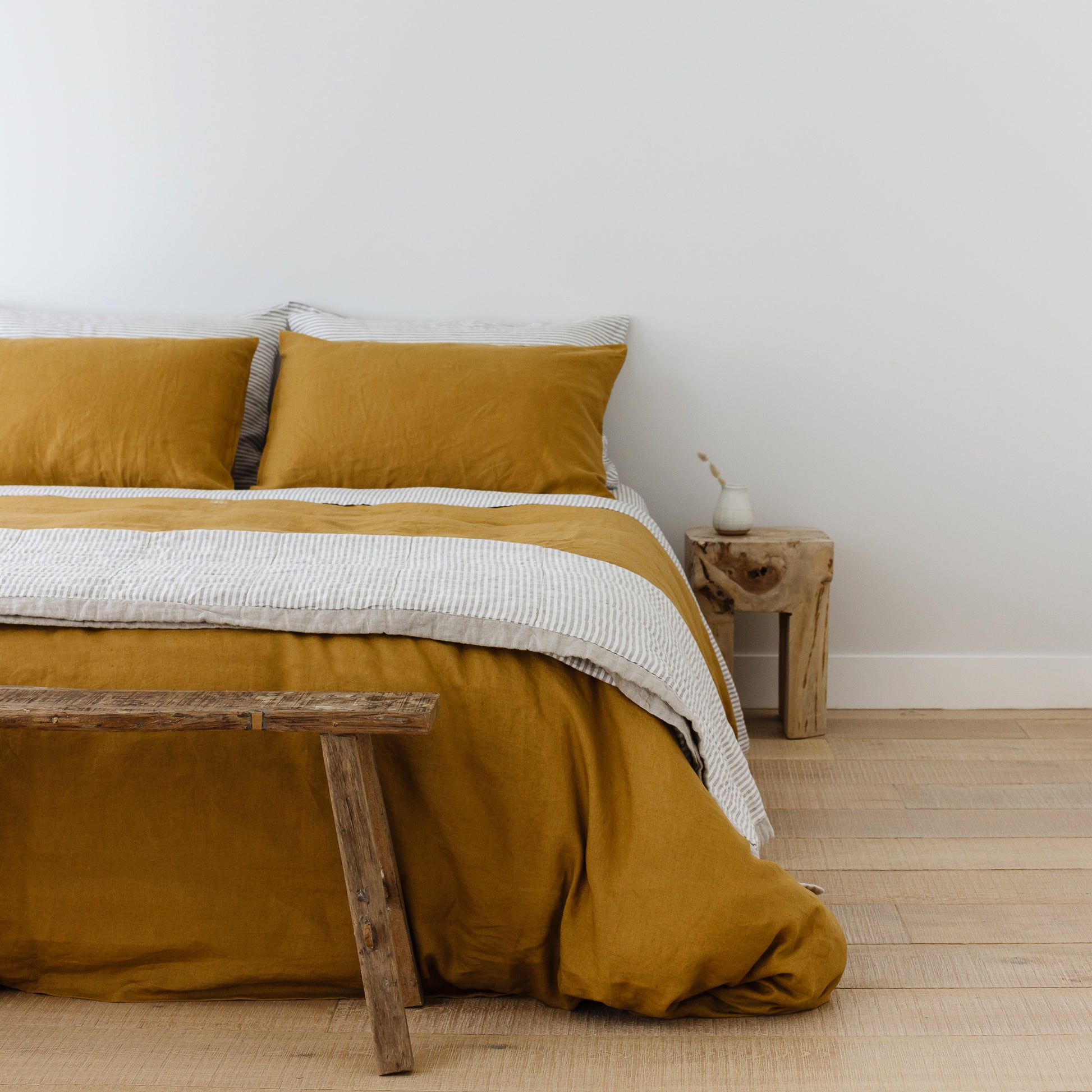 Foxtrot Home French Flax Linen styled in a bedroom with Ginger Honey Duvet.