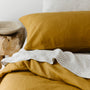 Foxtrot Home French Flax Linen styled in a bedroom with Ginger Honey Duvet.