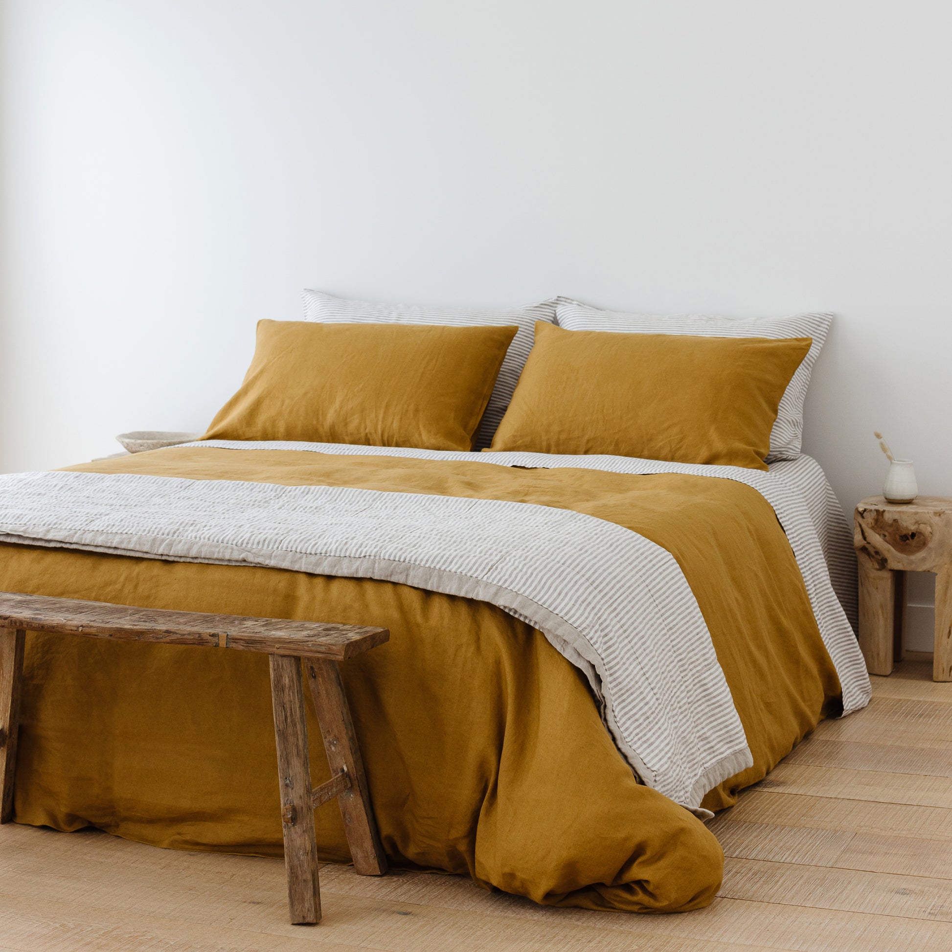 Foxtrot Home French Flax Linen styled in a bedroom with Ginger Honey Duvet.