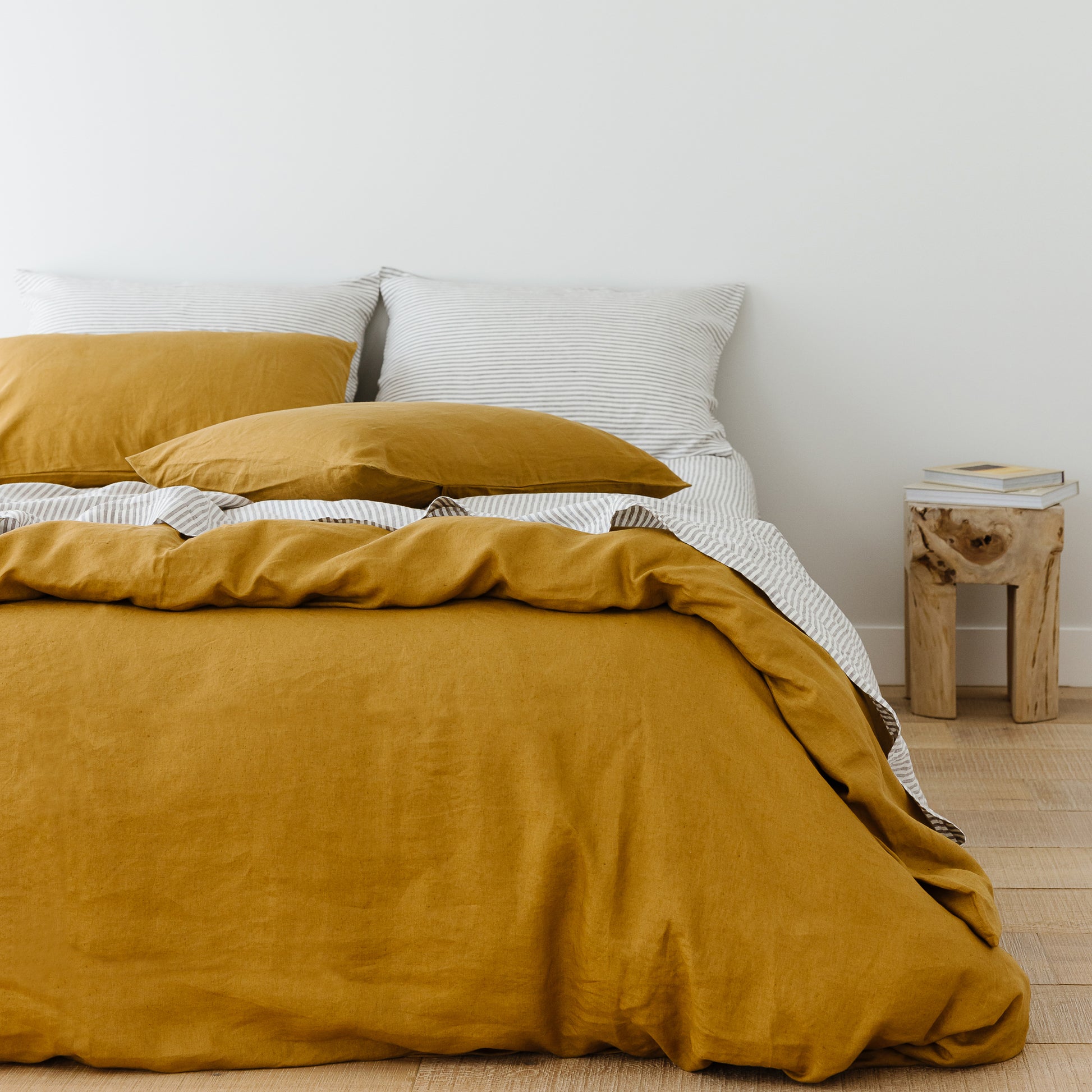 Foxtrot Home French Flax Linen styled in a bedroom with Ginger Honey Duvet.