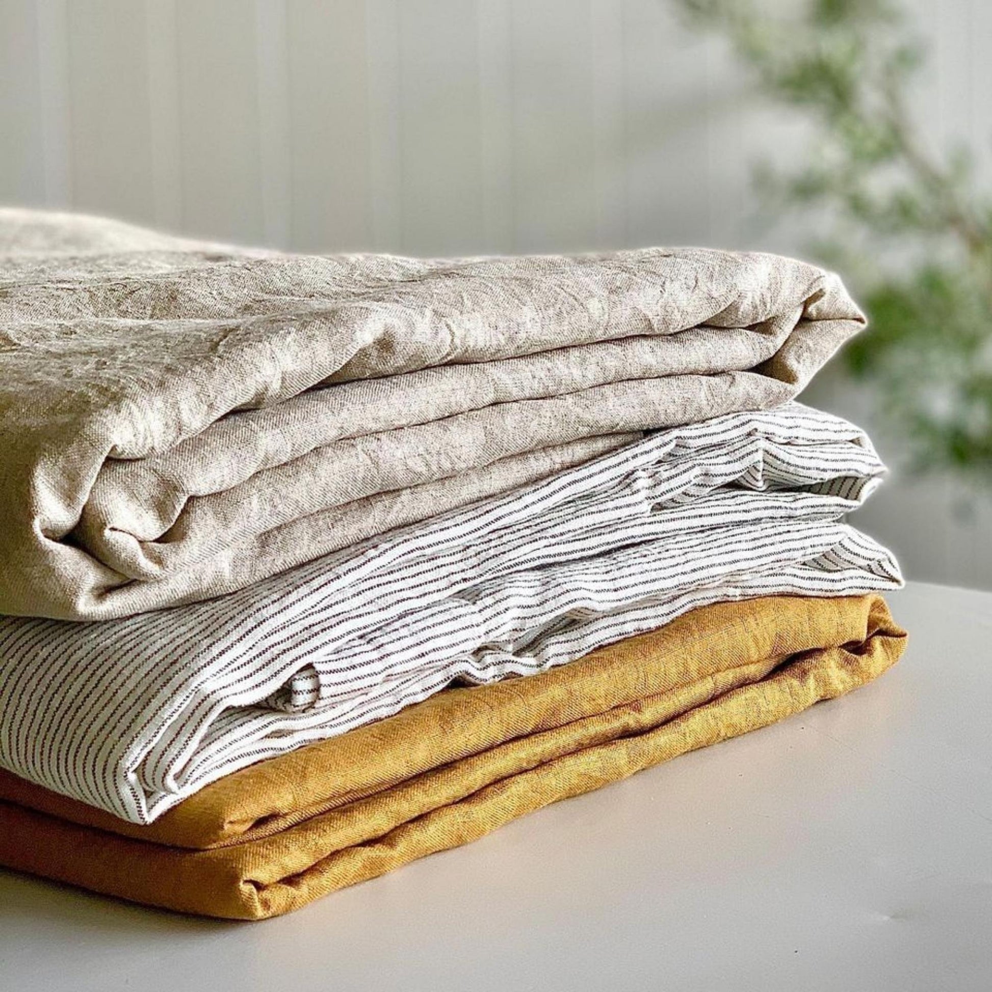Foxtrot Home French Flax Linen styled in a bedroom with Honey Ginger Pillowcases.