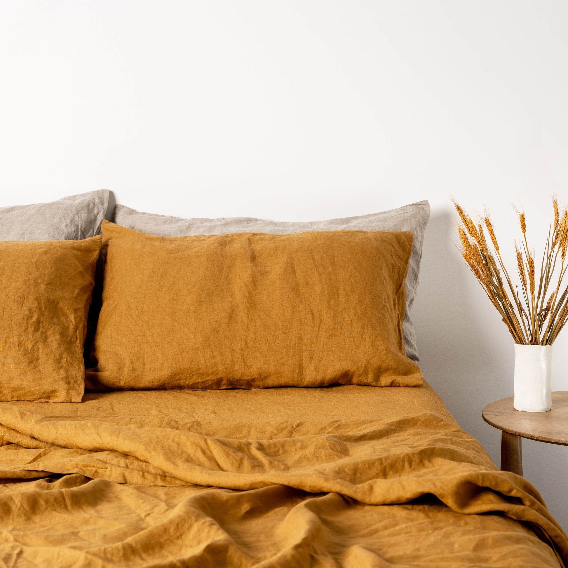 Foxtrot Home French Flax Linen styled in a bedroom with Honey Ginger Pillowcases.