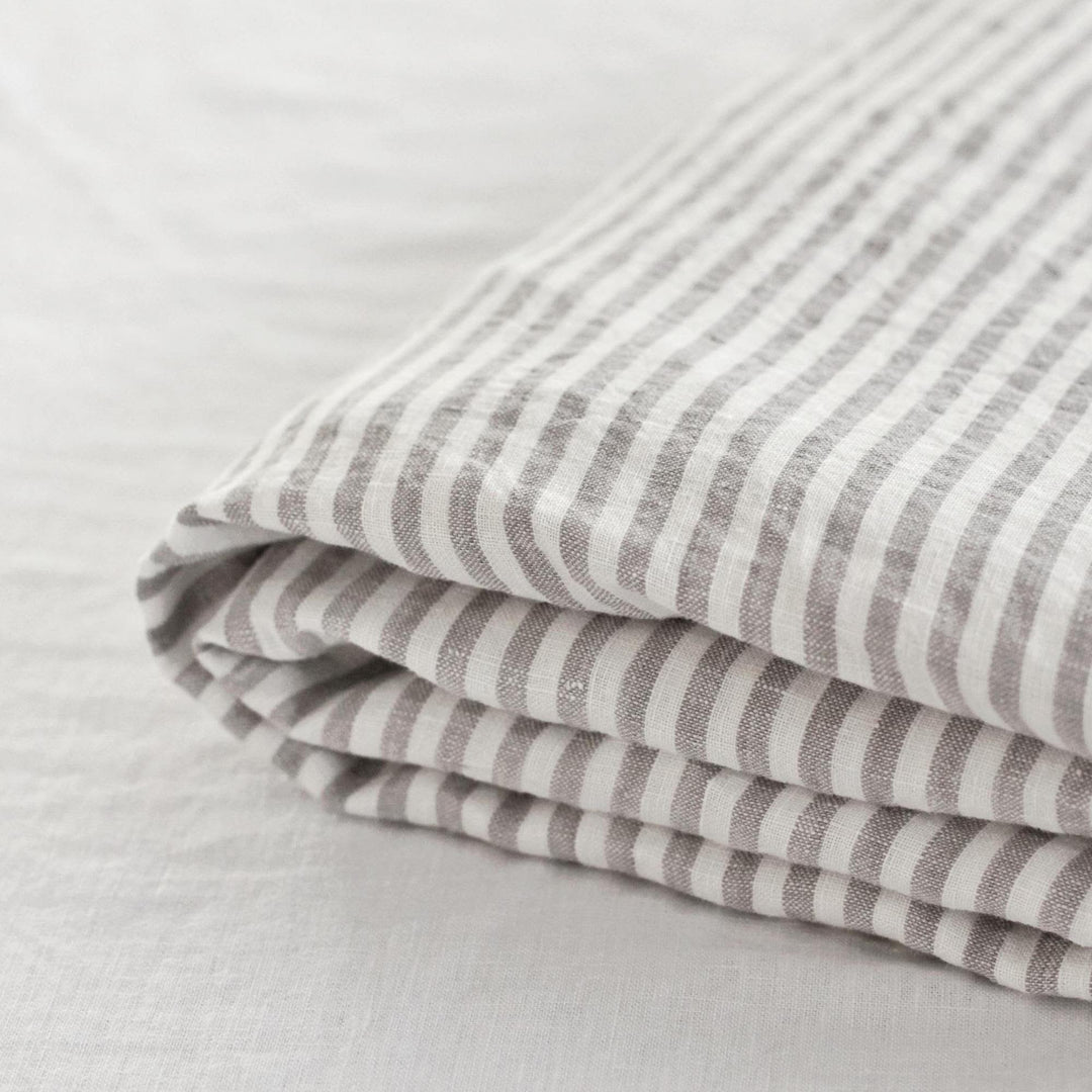 Foxtrot Home French Flax Linen styled in a bedroom with Grey Stripes Fitted Sheet.