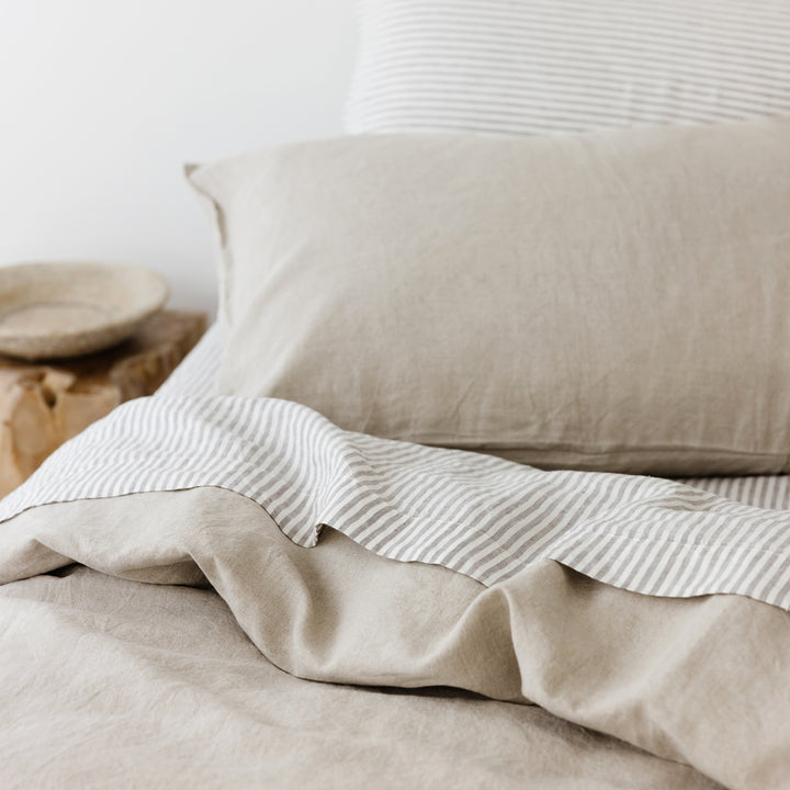 Foxtrot Home French Flax Linen styled in a bedroom with Grey Stripes Fitted Sheet.