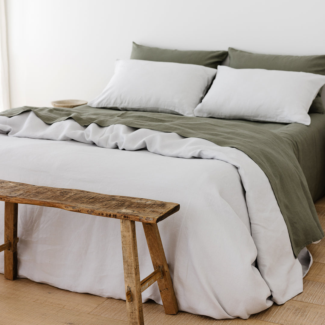 Foxtrot Home French Flax Linen styled in a bedroom with Light Grey Duvet.