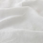 Foxtrot Home French Flax Linen styled in a bedroom with Light Grey Duvet.