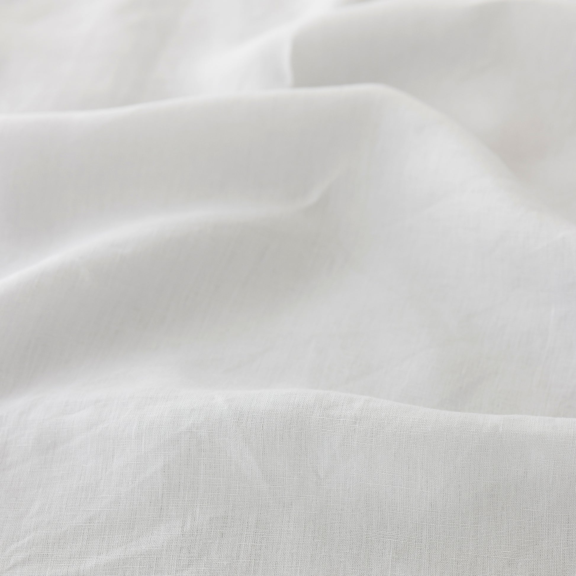 Foxtrot Home French Flax Linen styled in a bedroom with Light Grey Duvet.