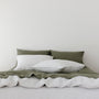Foxtrot Home French Flax Linen styled in a bedroom with Light Grey Duvet.