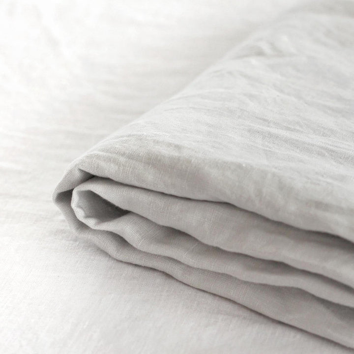 Foxtrot Home French Flax Linen styled in a bedroom with Light Grey Fitted Sheet.