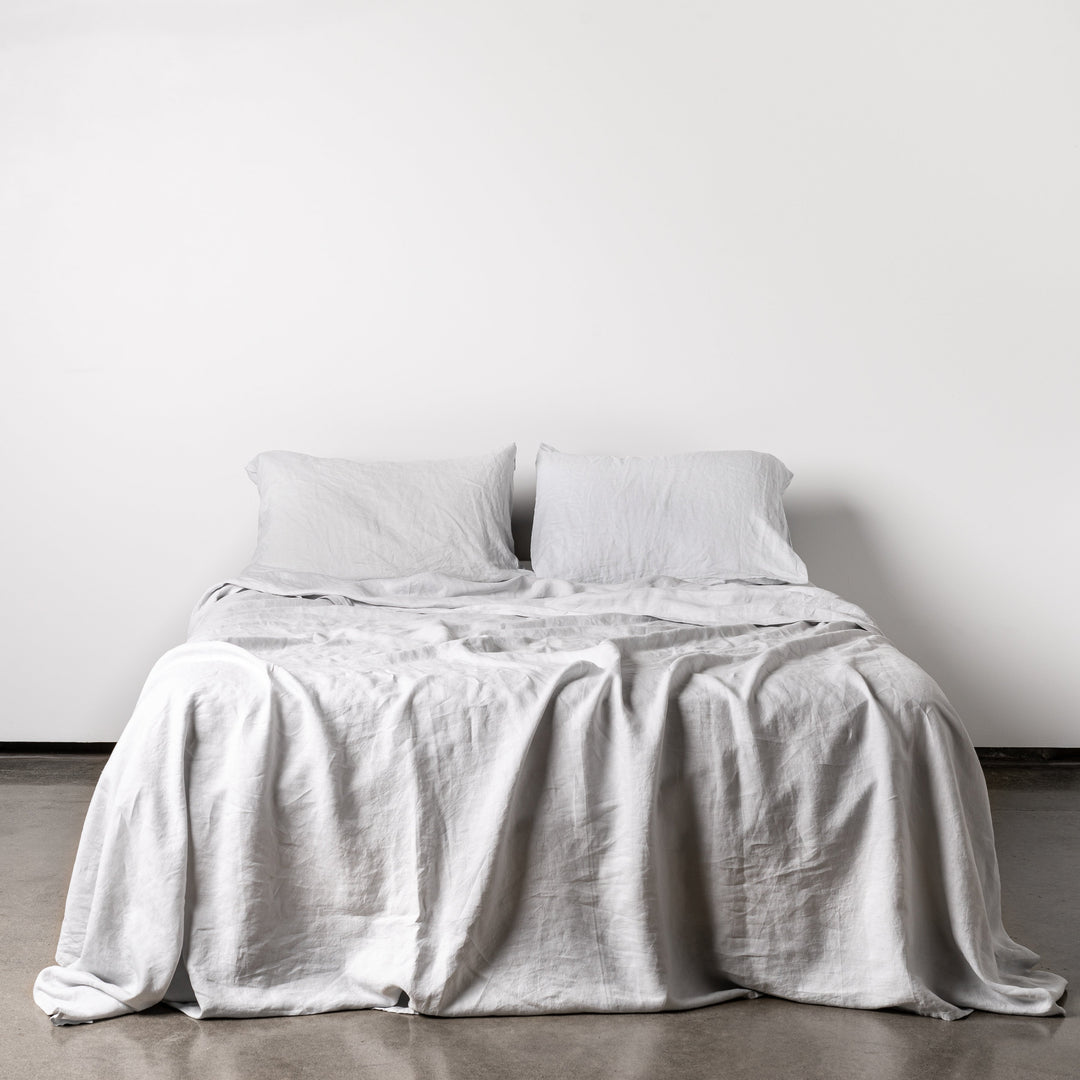Foxtrot Home French Flax Linen styled in a bedroom with Light Grey Fitted Sheet.