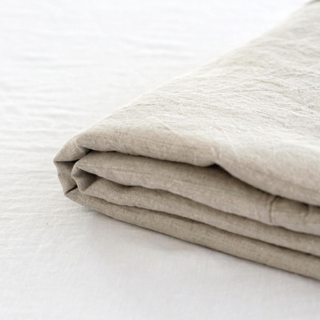 Foxtrot Home French Flax Linen styled in a bedroom with Natural Fitted Sheet.