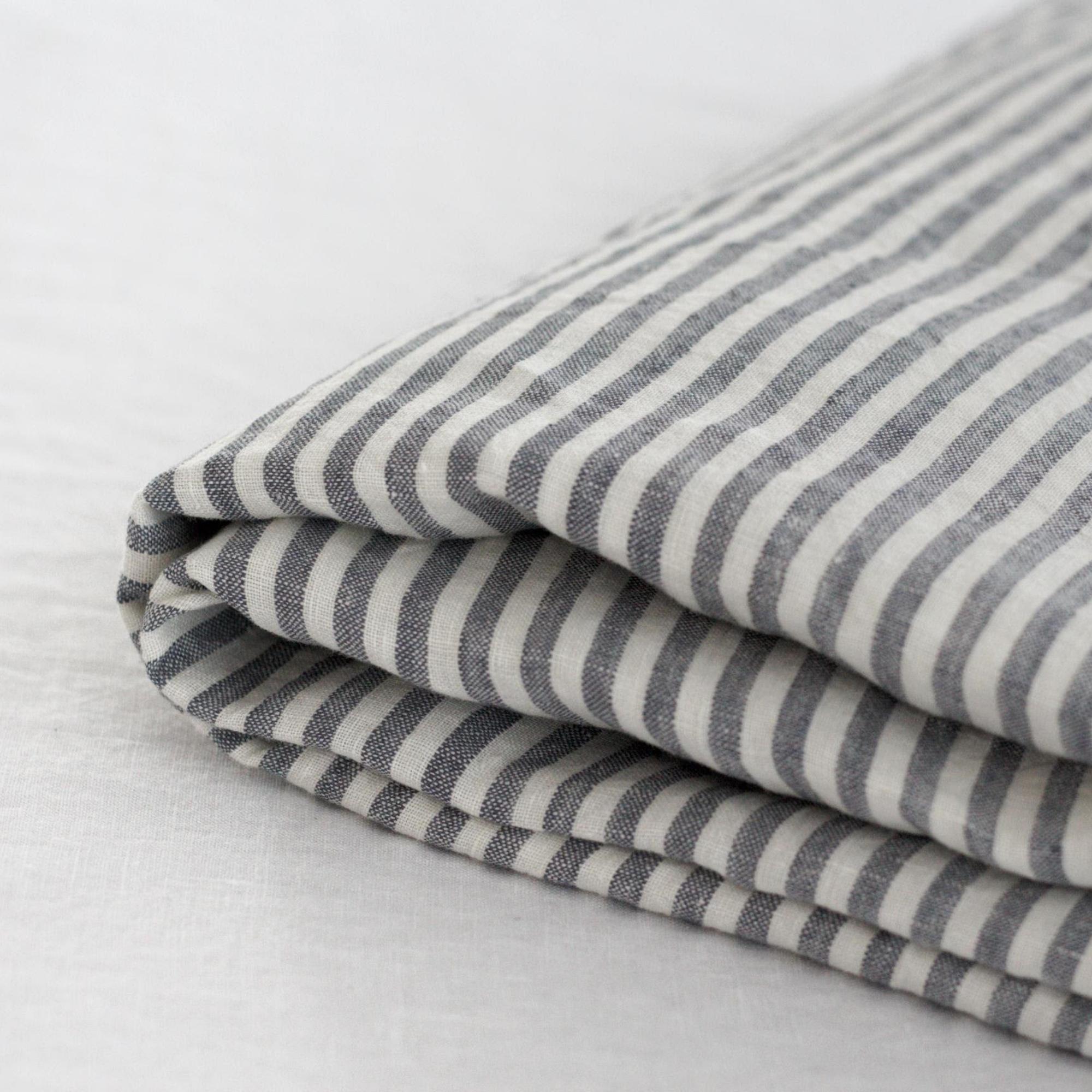 Foxtrot Home French Flax Linen styled in a bedroom with Navy Stripes Sheets Set.