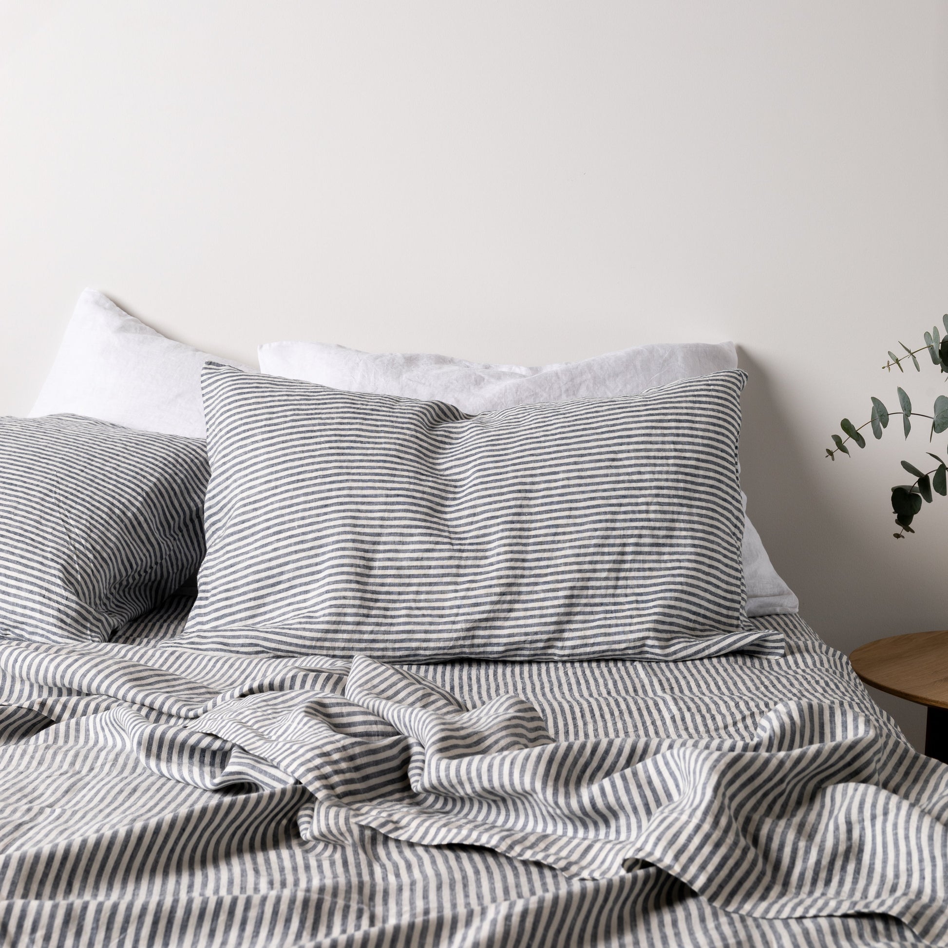 Foxtrot Home French Flax Linen styled in a bedroom with Navy Stripes Sheets Set.