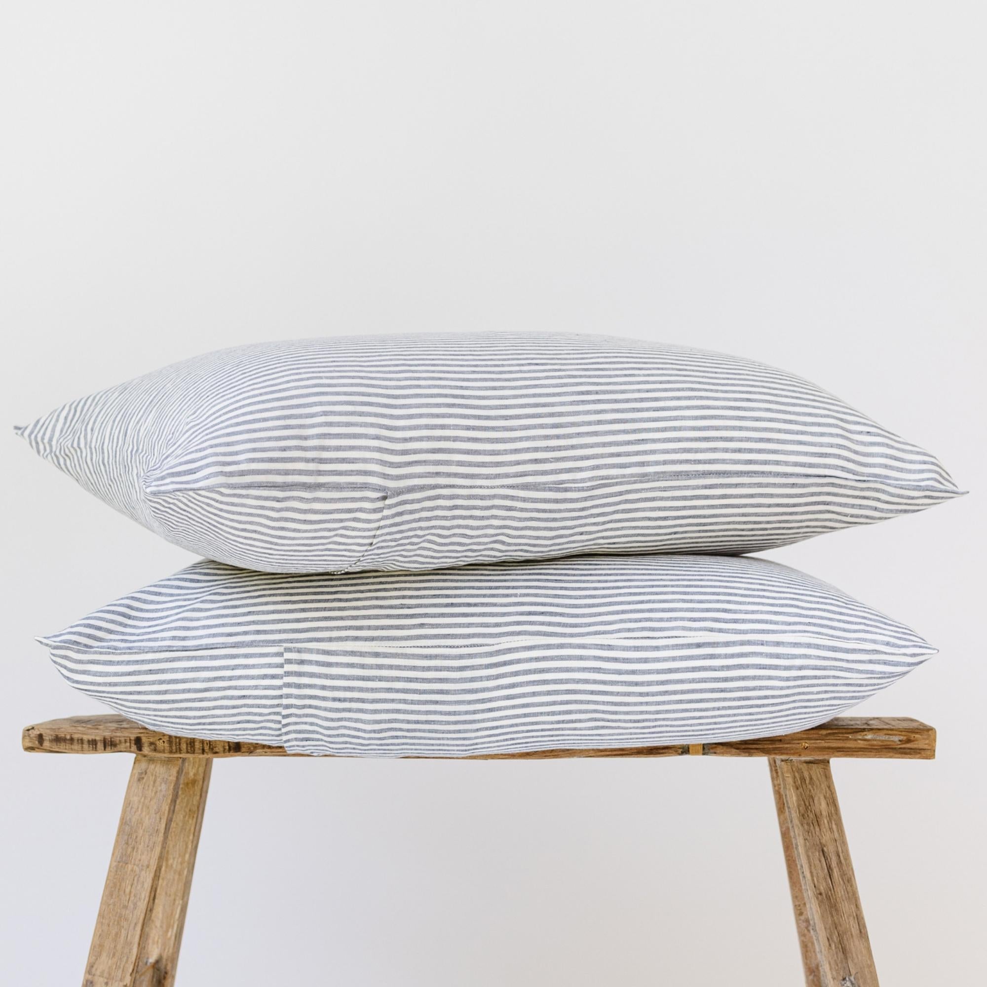 Foxtrot Home French Flax Linen styled in a bedroom with Navy Stripes Pillowcases.