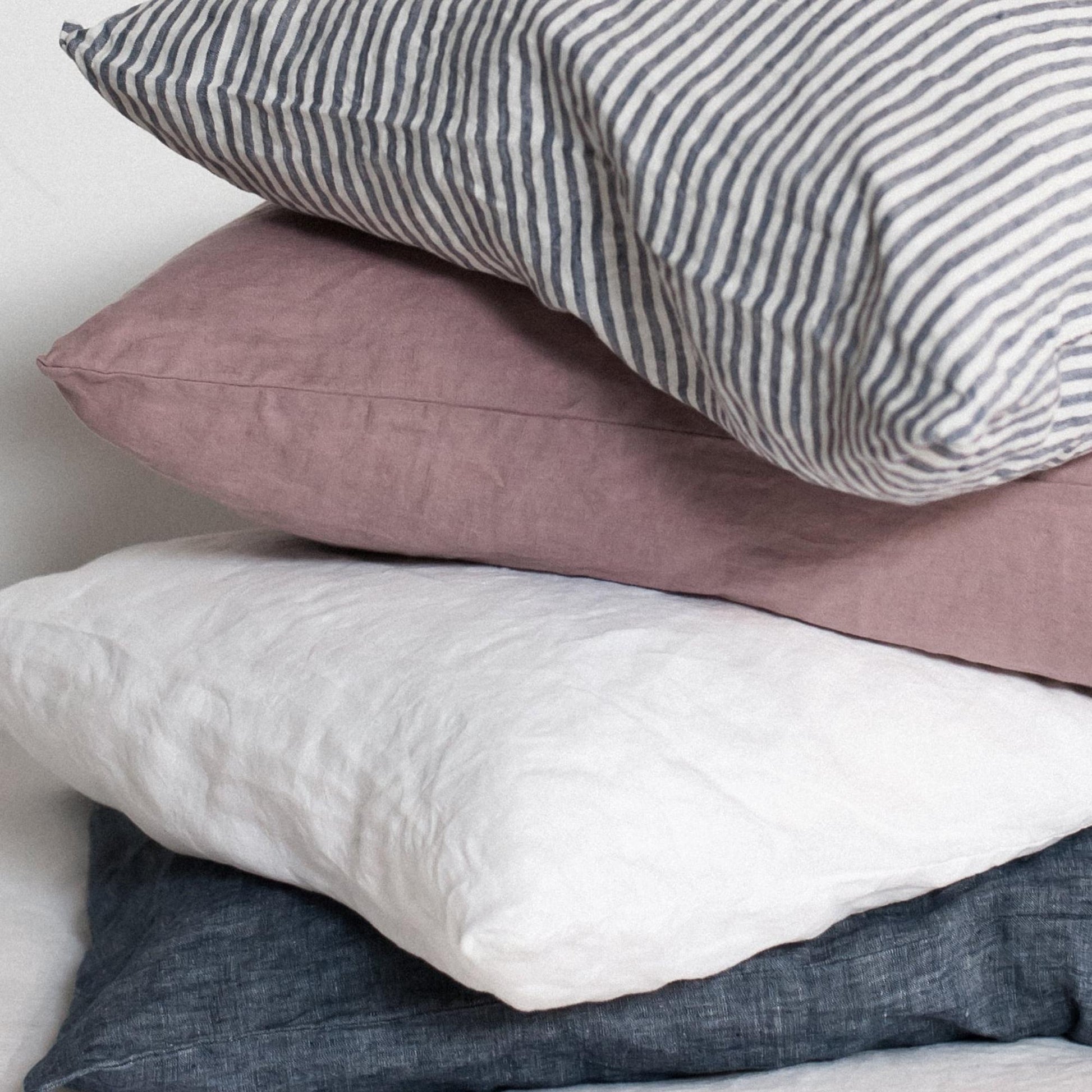Foxtrot Home French Flax Linen styled in a bedroom with Navy Stripes Pillowcases.