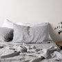 Foxtrot Home French Flax Linen styled in a bedroom with Navy Stripes Pillowcases.