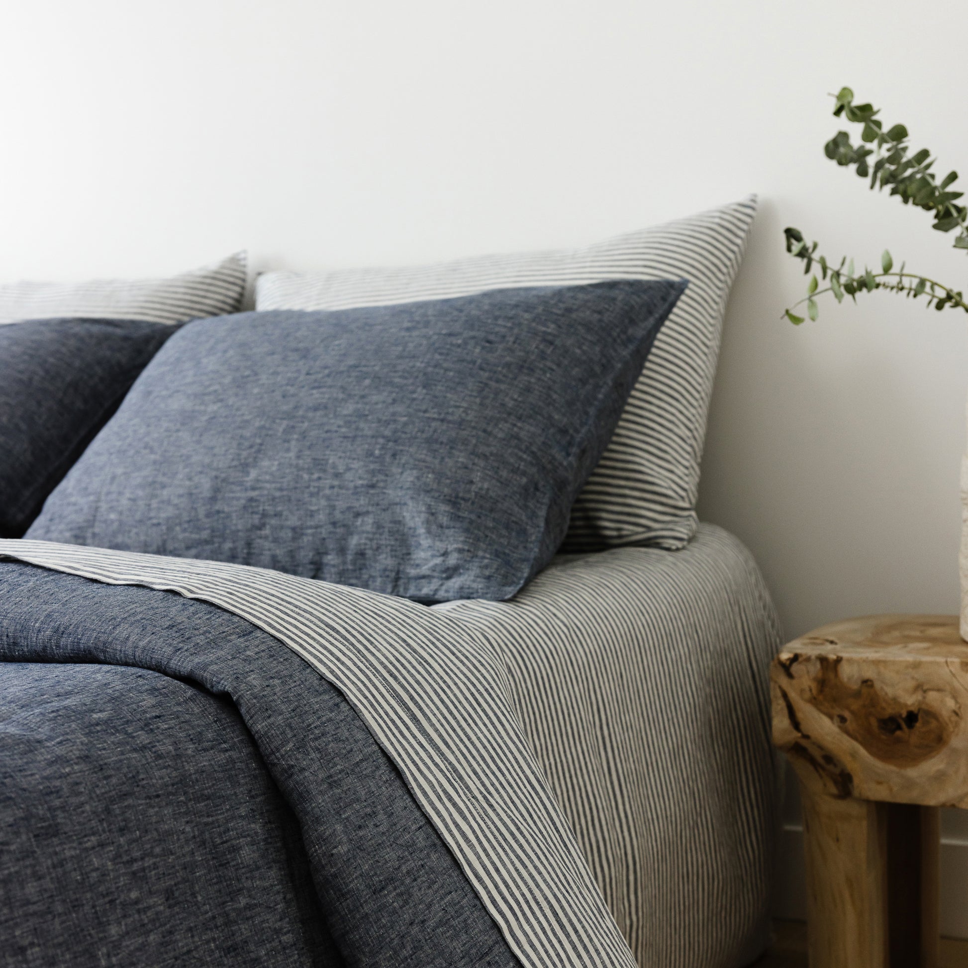 Foxtrot Home French Flax Linen styled in a bedroom with Navy Stripes Pillowcases.